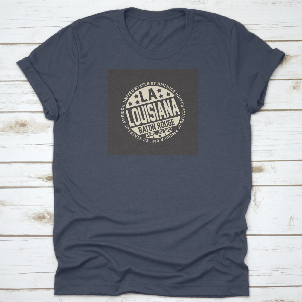 Decorative stamp t-shirt featuring LA postal abbreviation on a black background, showcasing a stylish design.