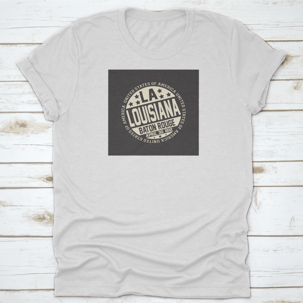 Decorative stamp t-shirt featuring LA postal abbreviation on a black background, showcasing a stylish design.