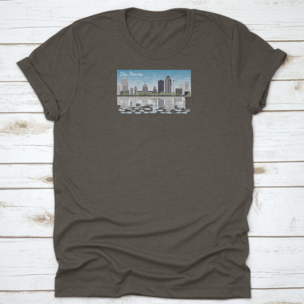 Des Moines skyline featuring grey buildings under a blue sky, printed on a comfortable cotton T-shirt.