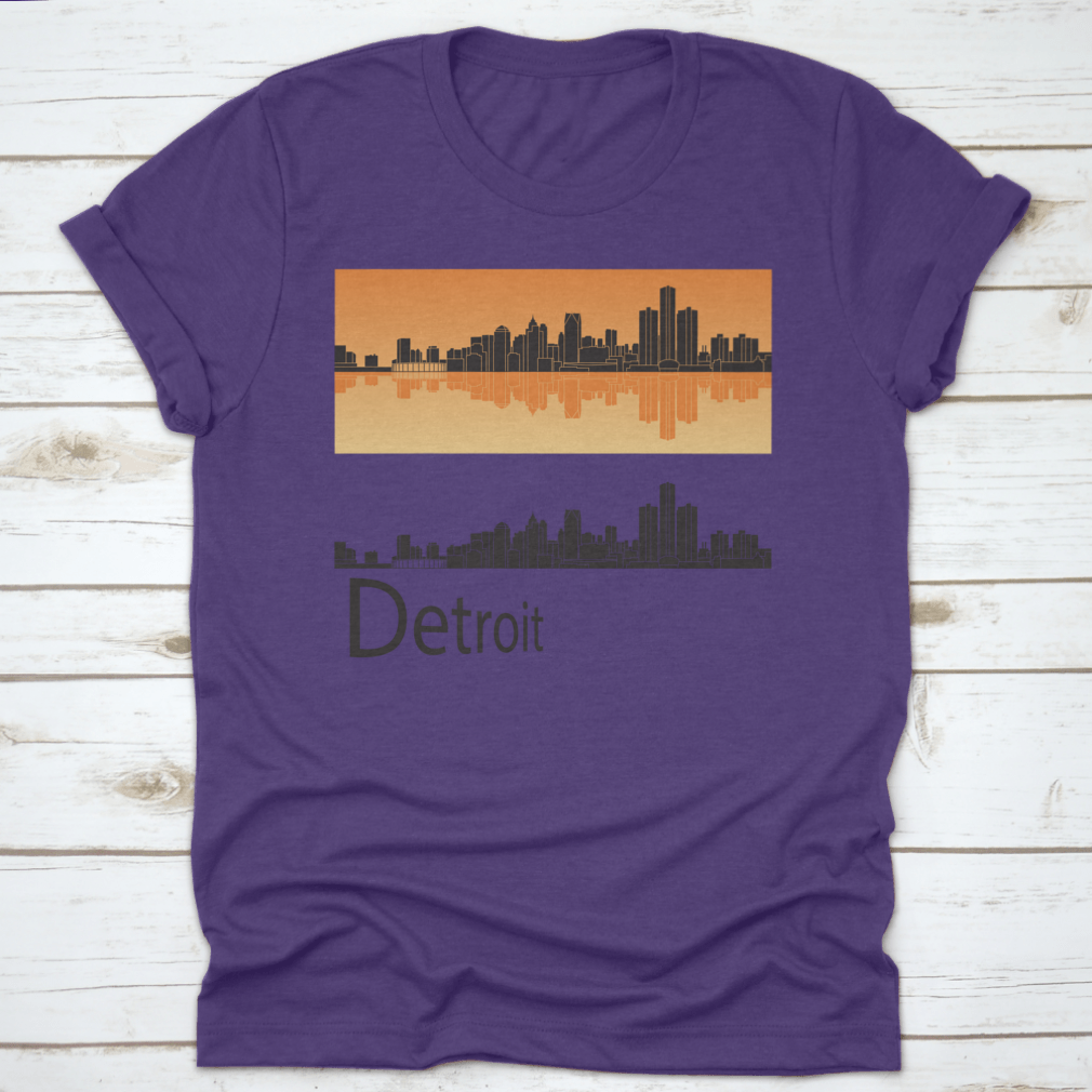 A vibrant orange t-shirt featuring the Detroit skyline reflected against a bright background, showcasing the city's iconic architecture.