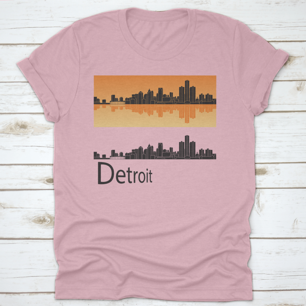 A vibrant orange t-shirt featuring the Detroit skyline reflected against a bright background, showcasing the city's iconic architecture.