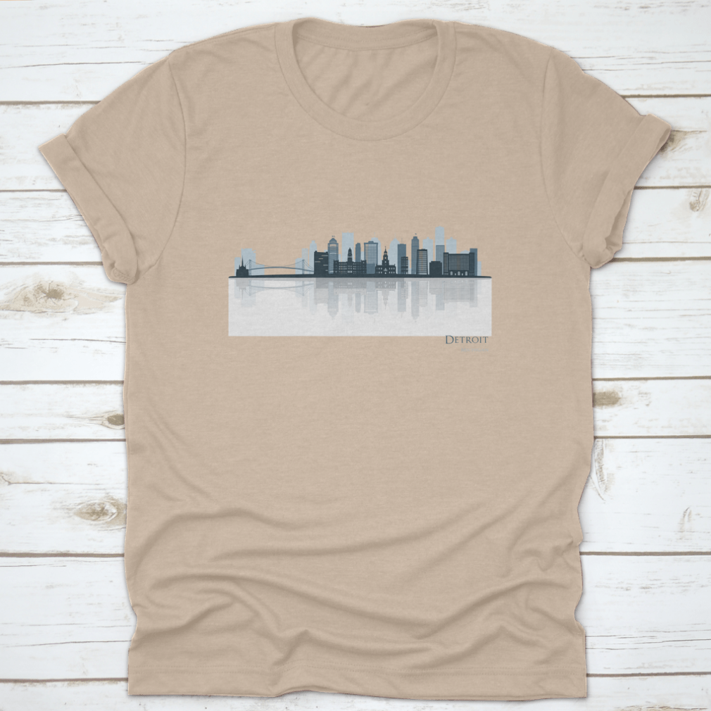 A stylish t-shirt featuring the Detroit skyline silhouette with reflection, showcasing iconic buildings in a modern design.