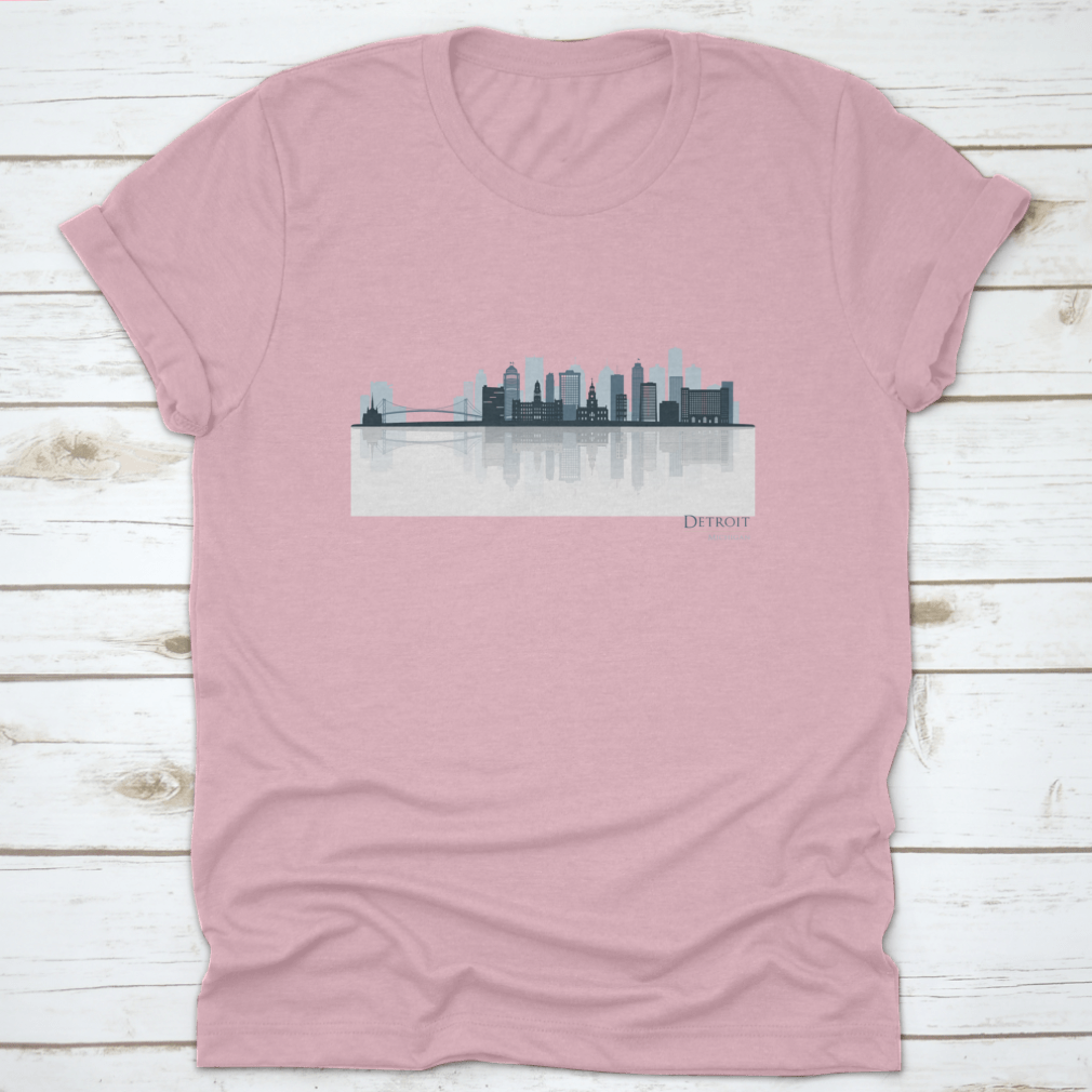 A stylish t-shirt featuring the Detroit skyline silhouette with reflection, showcasing iconic buildings in a modern design.