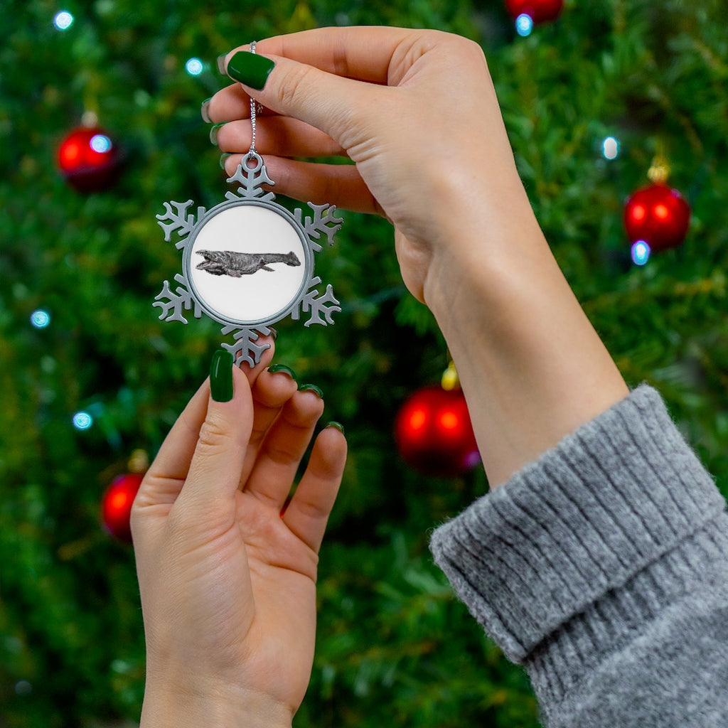 Dino Sea Creature Pewter Snowflake Ornament with silver-toned hanging string, showcasing intricate snowflake design.