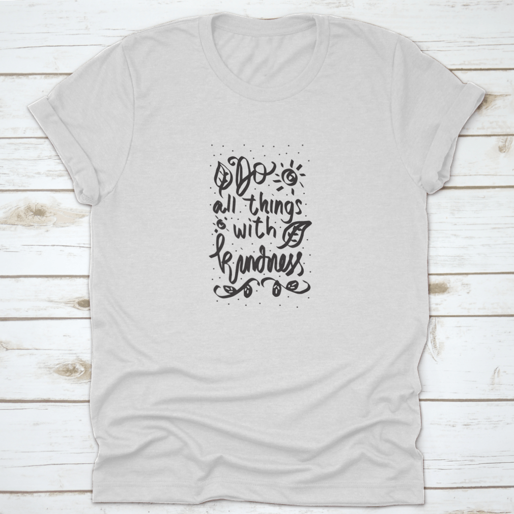 A stylish cotton t-shirt featuring a Floral Doodle design with the phrase 'Do All Things With Kindness' in a handwritten font.
