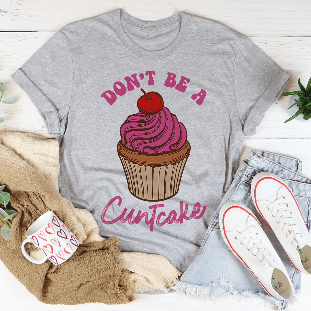 Don't Be A Cuntcake T-Shirt made from soft ring-spun cotton with double stitching for durability, featuring a humorous phrase.