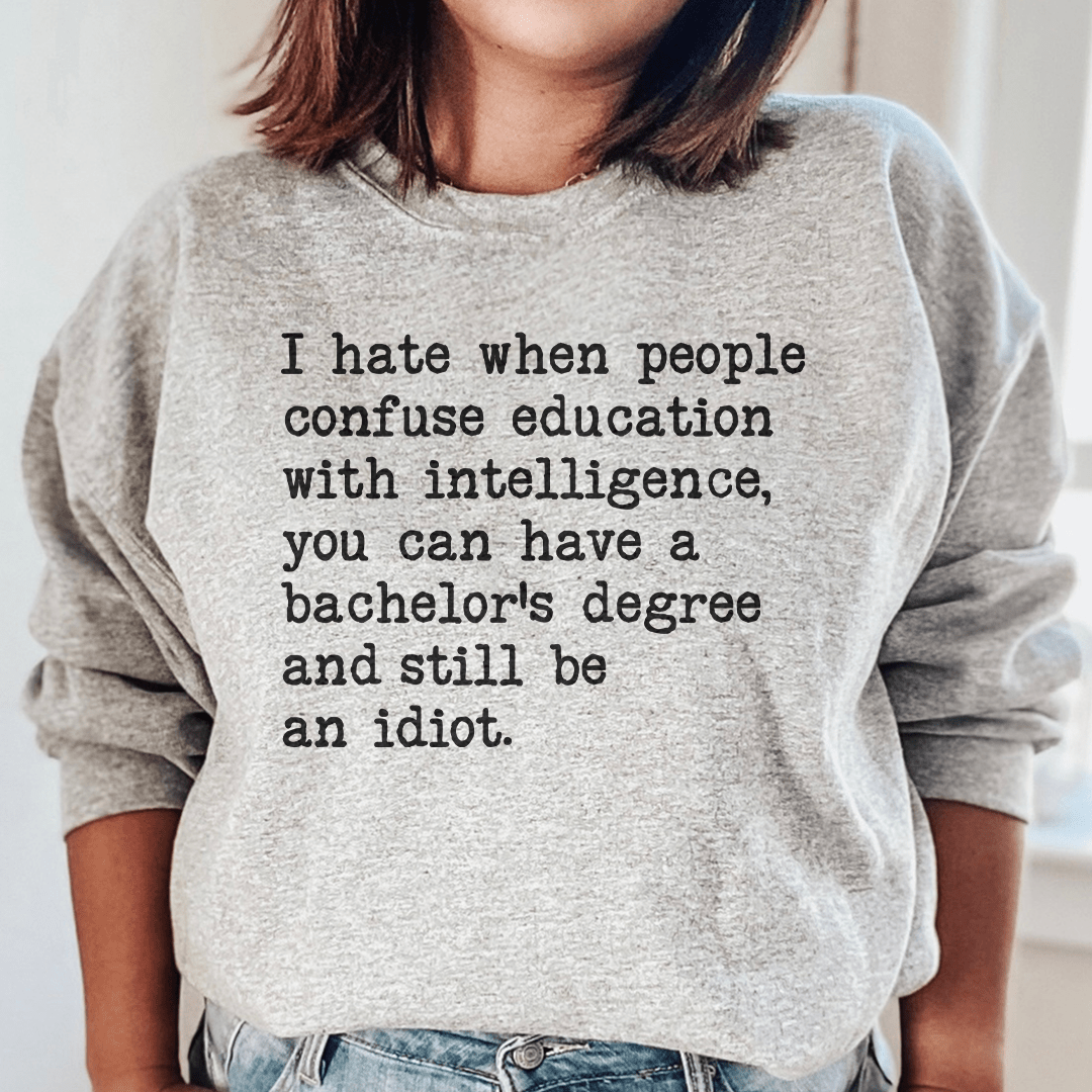 Cozy 'Don't Confuse Education With Intelligence' sweats featuring unique artistic designs, perfect for casual wear.