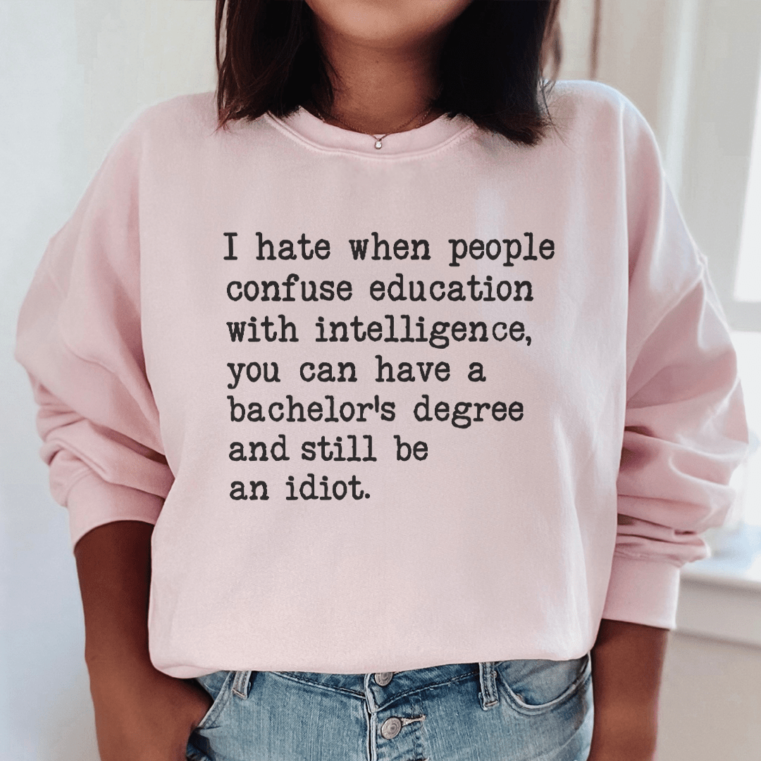 Cozy 'Don't Confuse Education With Intelligence' sweats featuring unique artistic designs, perfect for casual wear.