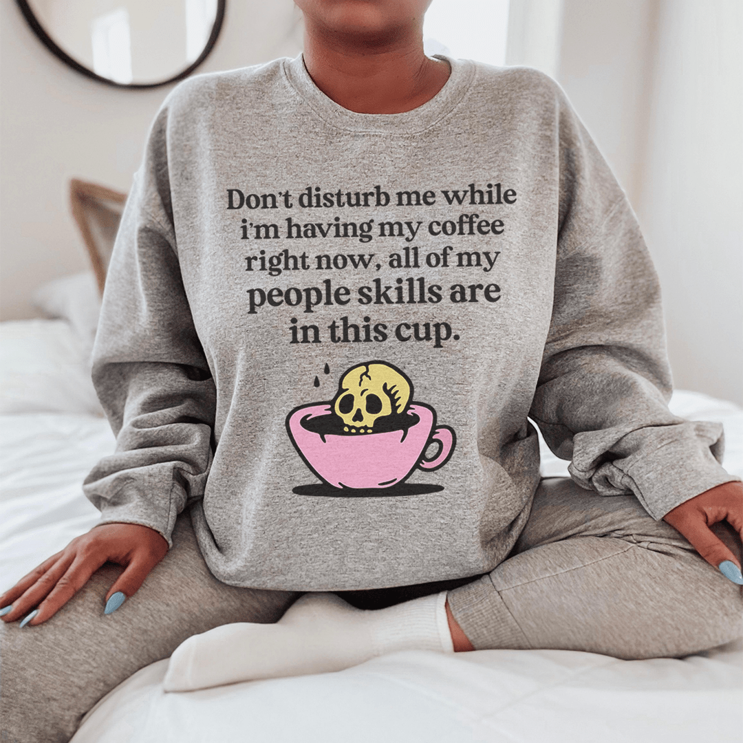 A cozy Don't Disturb Me Coffee hoodie made from cotton/poly fleece blend, featuring adjustable banded cuffs and a stylish design.