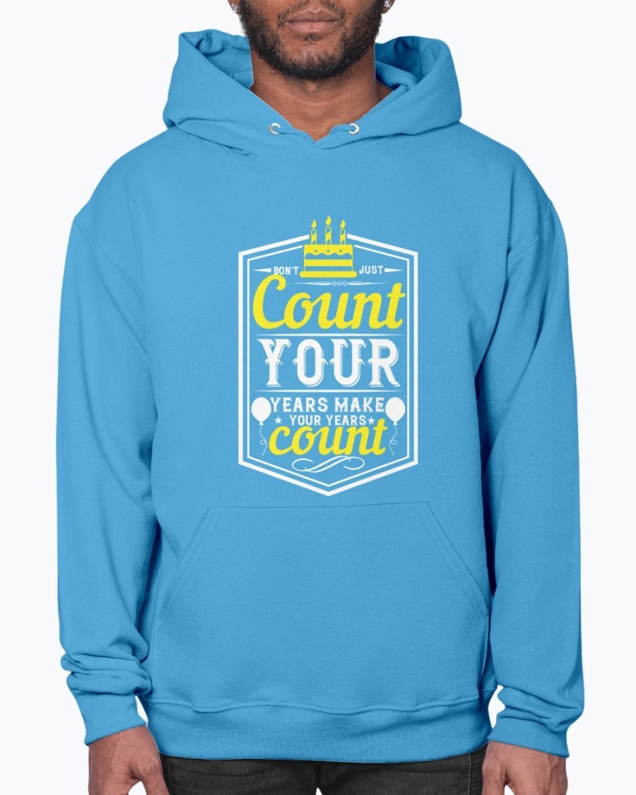 A stylish unisex hoodie featuring the motivational quote 'Don't just count your years, make your years count' in a vibrant design, perfect for birthday celebrations.