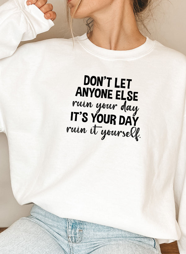 Cozy 'Don't Let Anyone Else Ruin Your Day' sweatshirt featuring a unique artistic design, perfect for casual wear.