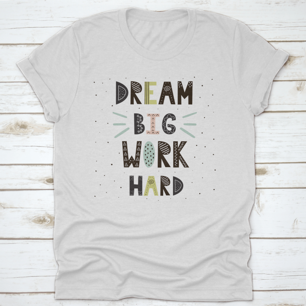 A stylish t-shirt featuring hand-drawn lettering that reads 'Dream Big Work Hard', made from soft cotton fabric.