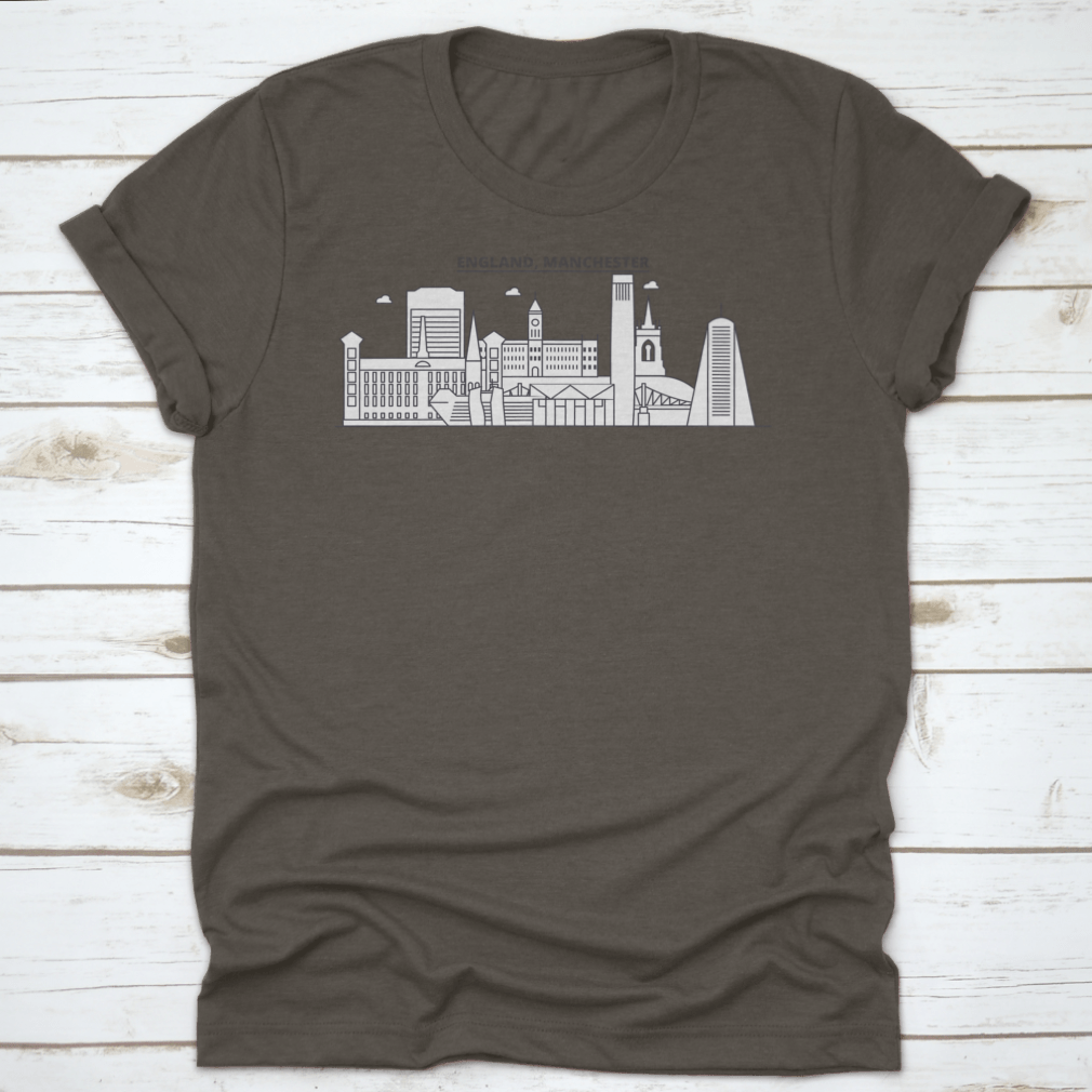 A stylish t-shirt featuring the Manchester skyline, showcasing iconic architecture in a vibrant design.