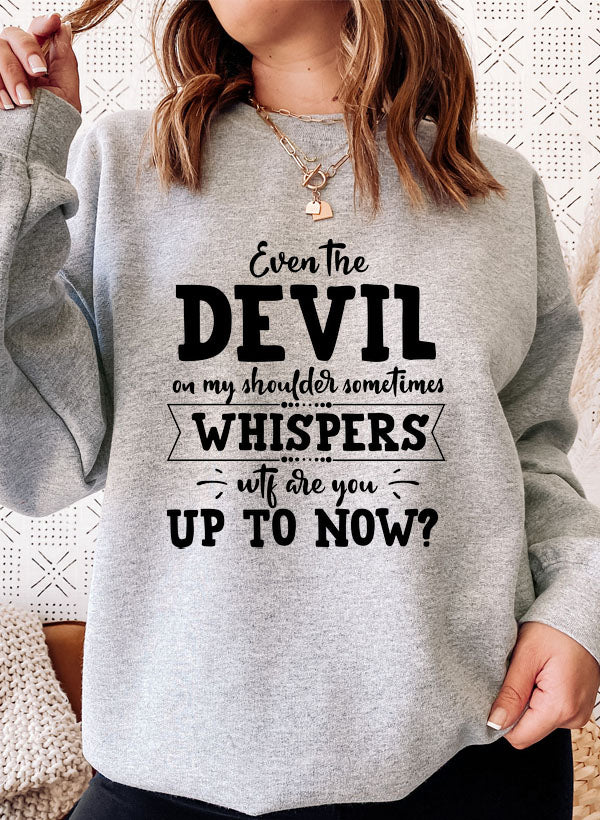 A cozy hoodie featuring the phrase 'Even The Devil On My Shoulder Sometimes Whispers WTF Are You Up To', designed by top artists.
