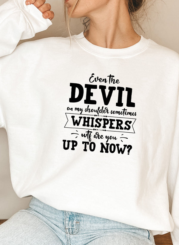 A cozy hoodie featuring the phrase 'Even The Devil On My Shoulder Sometimes Whispers WTF Are You Up To', designed by top artists.