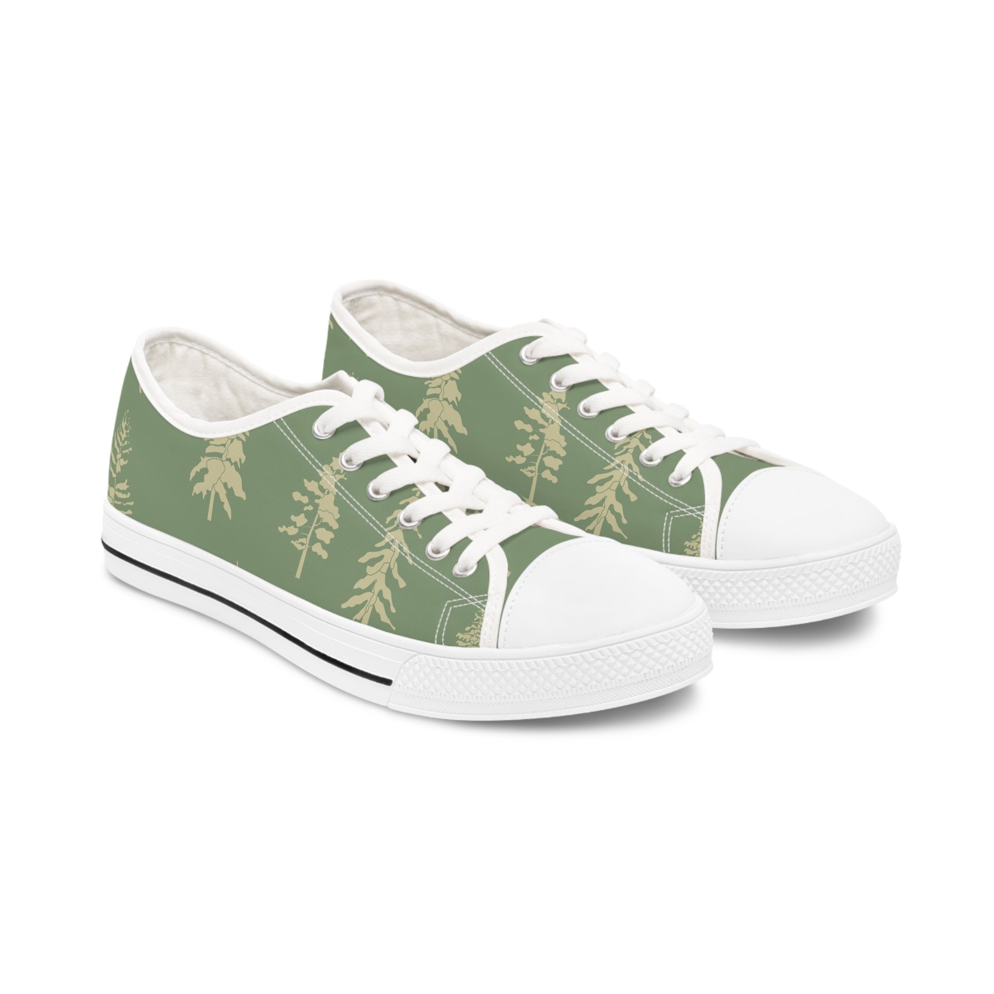 A pair of Evergreen Tree Women's Low Top Sneakers in black and white, showcasing breathable polyester canvas and stylish silver metal eyelets.