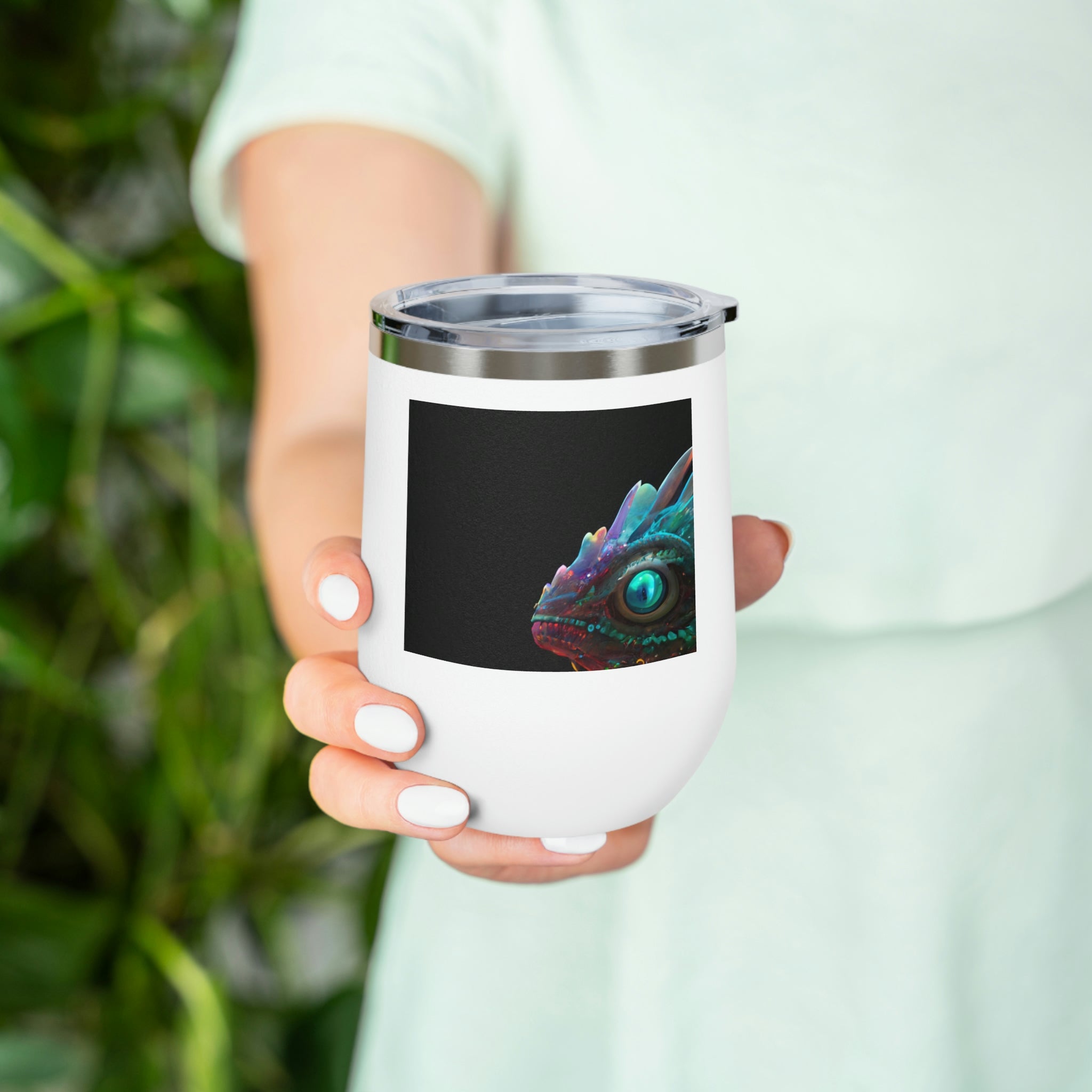 Feathered Dragon Wine Tumbler with a unique design, featuring a clear plastic lid and double-wall insulation for hot and cold beverages.