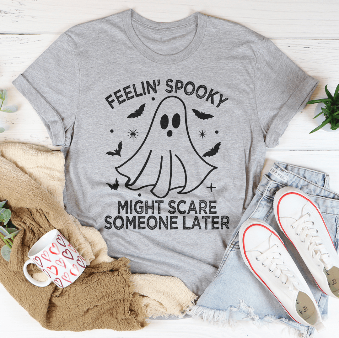 Feelin' Spooky Might Scare Someone Later T-Shirt in black with vibrant spooky design, showcasing its soft fabric and durable stitching.
