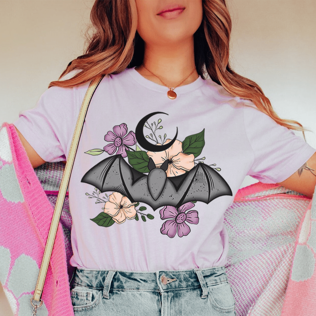 A stylish Floral Bat Tee featuring a vibrant bat design with floral elements, made from 100% soft cotton.