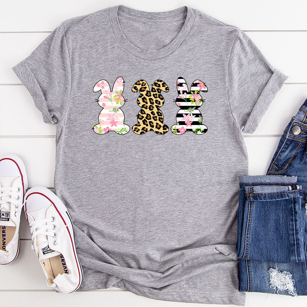Floral Easter Bunnies T-Shirt featuring vibrant floral patterns and cute bunny designs, made from soft cotton.