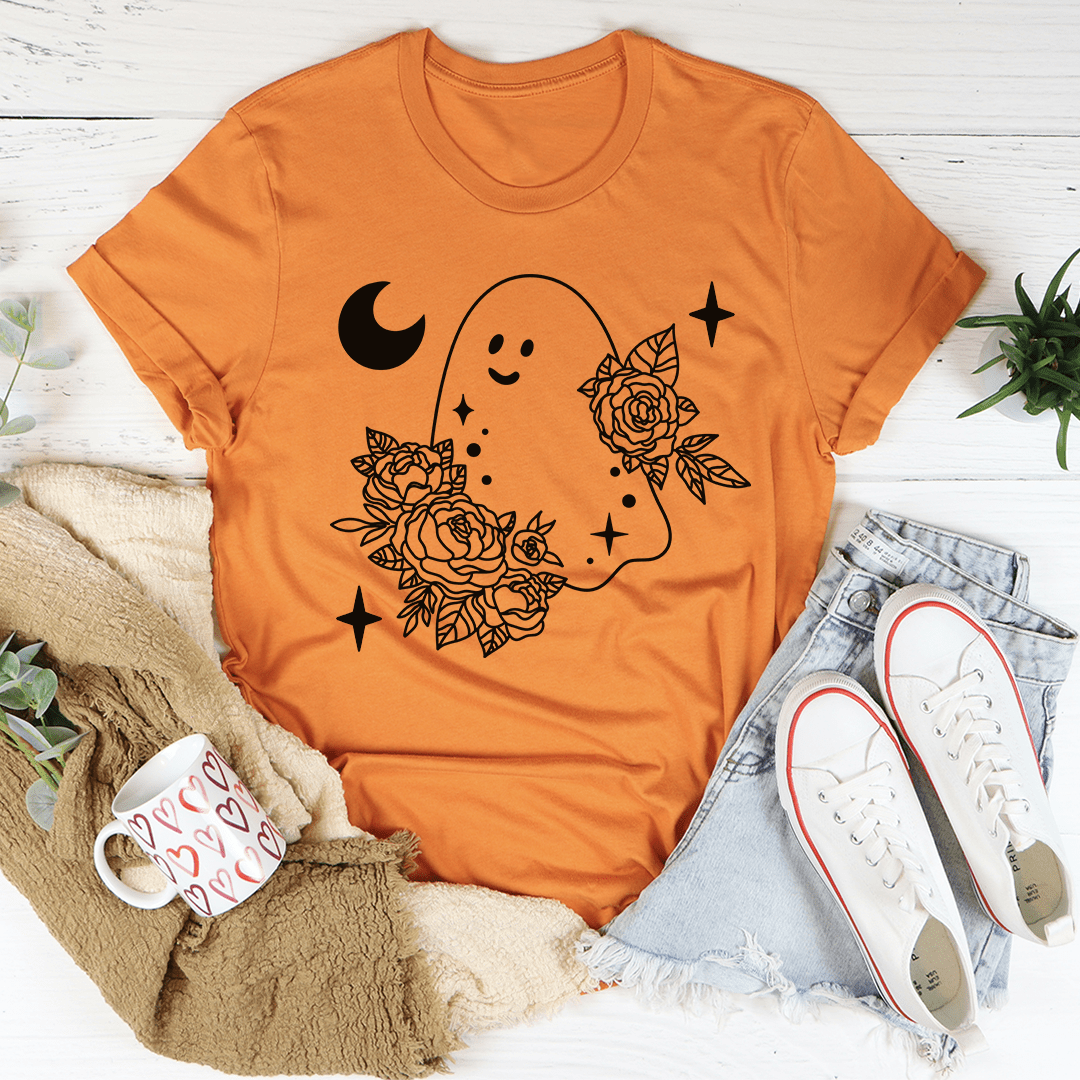 A stylish Floral Ghost Tee featuring a playful ghost design surrounded by vibrant flowers, perfect for Halloween celebrations.