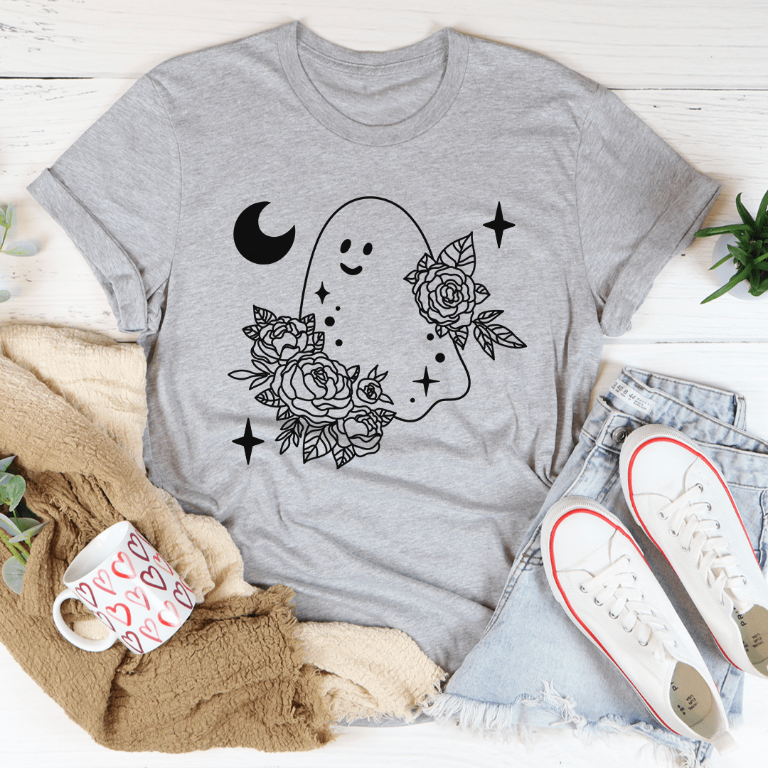 A stylish Floral Ghost Tee featuring a playful ghost design surrounded by vibrant flowers, perfect for Halloween celebrations.