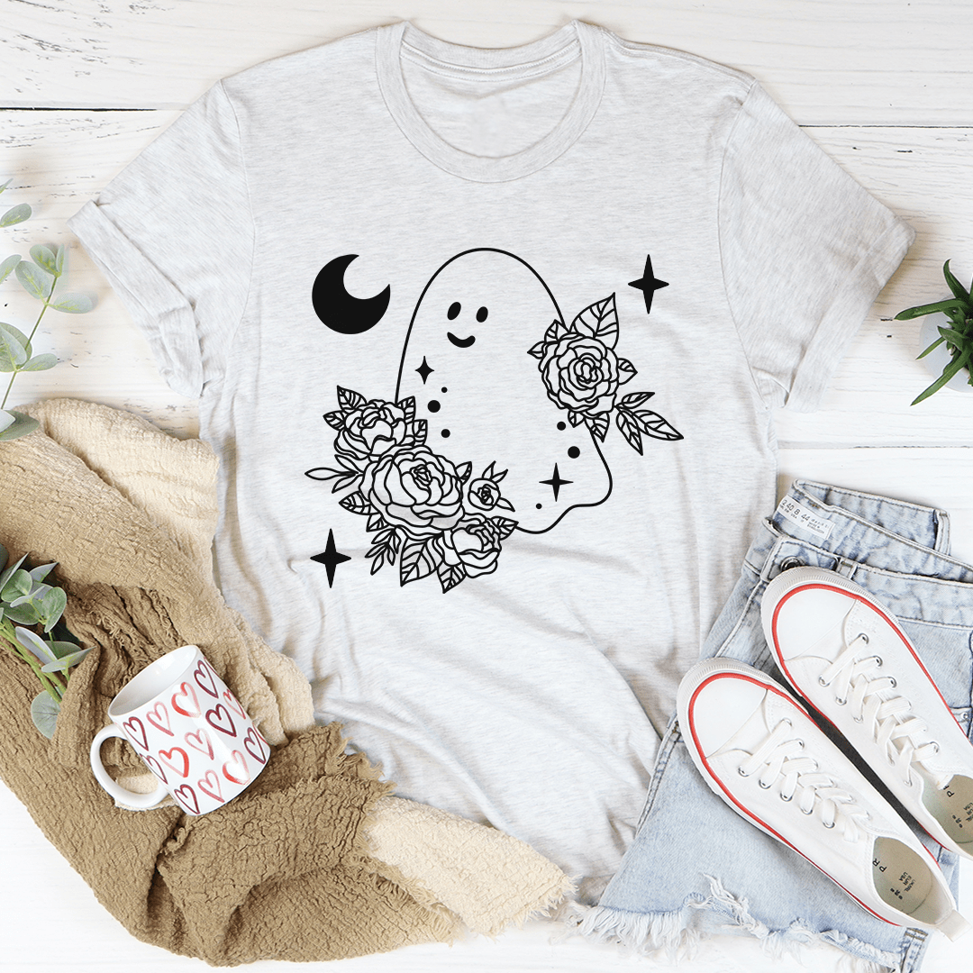 A stylish Floral Ghost Tee featuring a playful ghost design surrounded by vibrant flowers, perfect for Halloween celebrations.
