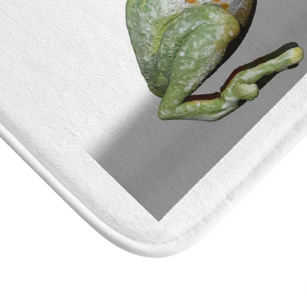 A vibrant frog-themed bath mat with anti-slip backing, showcasing a playful design perfect for bathroom decor.