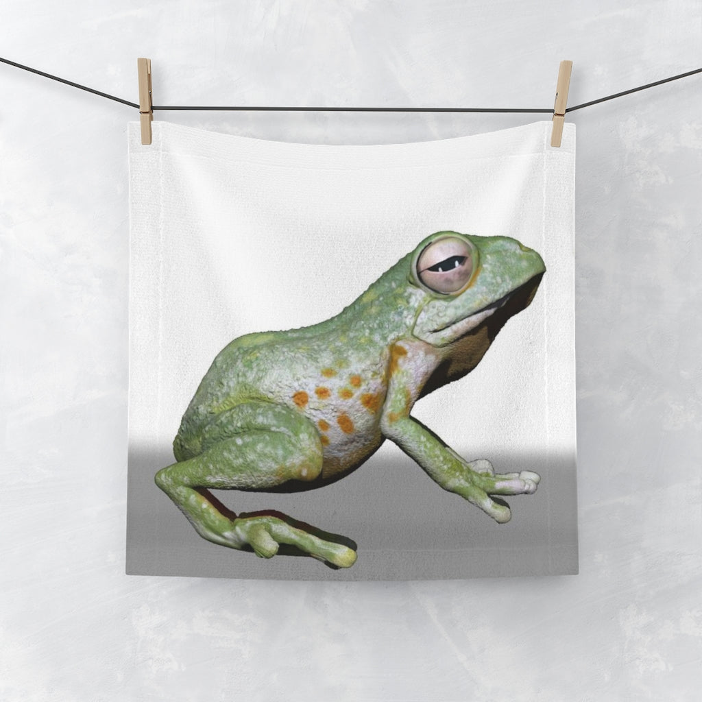 A vibrant Frog Face Towel featuring a colorful frog design on a soft polyester front and a plush cotton back, perfect for drying.