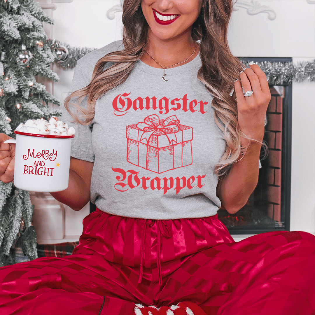 Gangster Wrapper Tee featuring a festive design, made from 100% soft cotton, perfect for holiday celebrations.