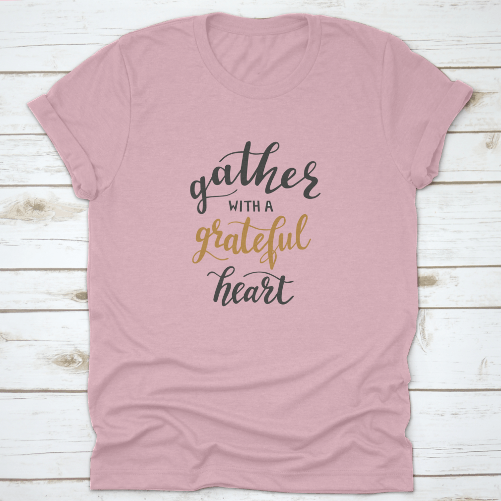 A comfortable t-shirt featuring the motivational quote 'Gather With A Grateful Heart' in an inspiring design, perfect for casual wear.