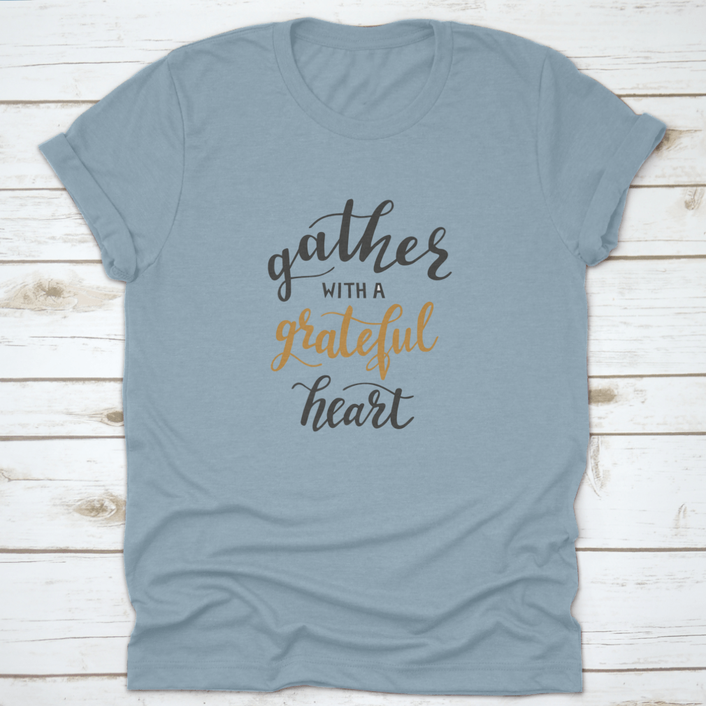 A comfortable t-shirt featuring the motivational quote 'Gather With A Grateful Heart' in an inspiring design, perfect for casual wear.