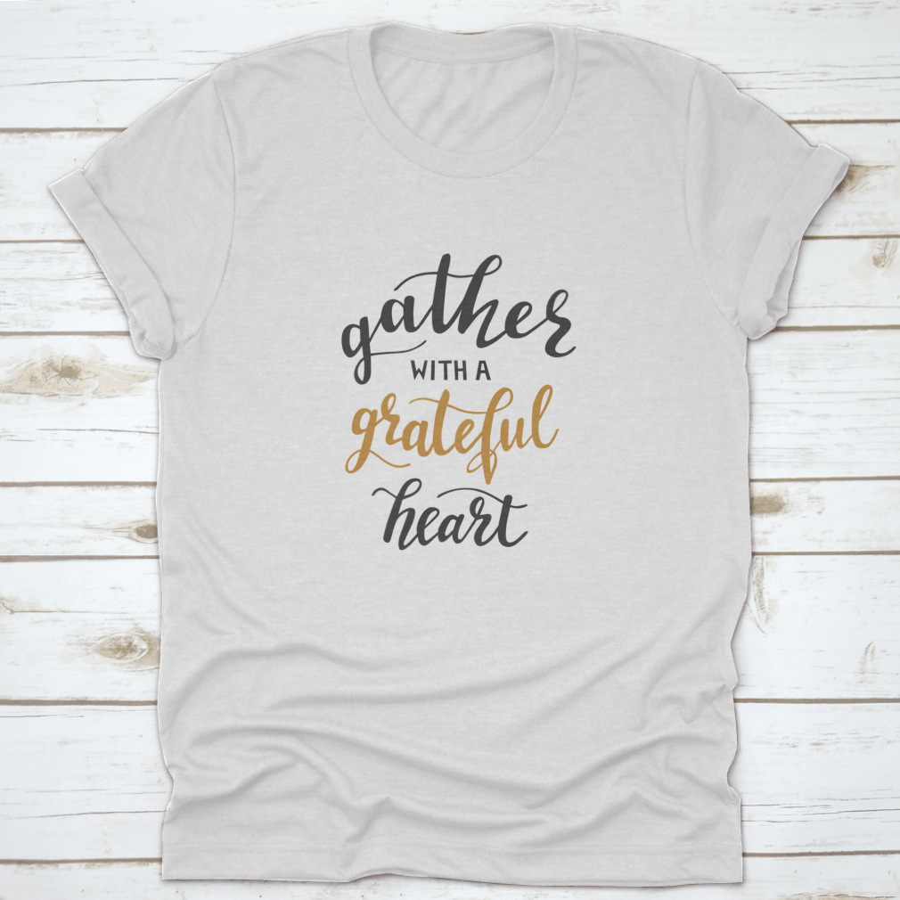A comfortable t-shirt featuring the motivational quote 'Gather With A Grateful Heart' in an inspiring design, perfect for casual wear.