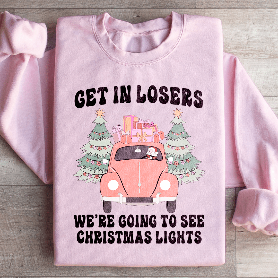 Cozy hoodie featuring the phrase 'Get In Losers We're Going To See Christmas Lights', designed by top artists, perfect for winter outings.