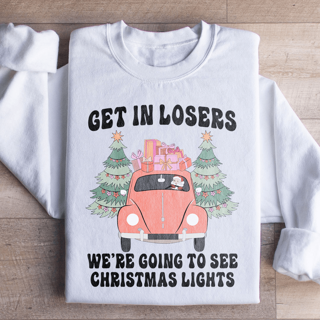 Cozy hoodie featuring the phrase 'Get In Losers We're Going To See Christmas Lights', designed by top artists, perfect for winter outings.