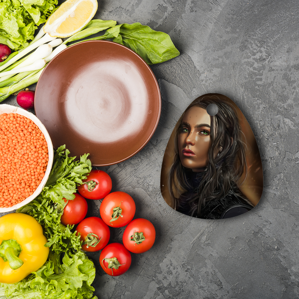 A stylish round glass cutting board in a water droplet shape, featuring a customizable surface for sublimation with artwork or logos.