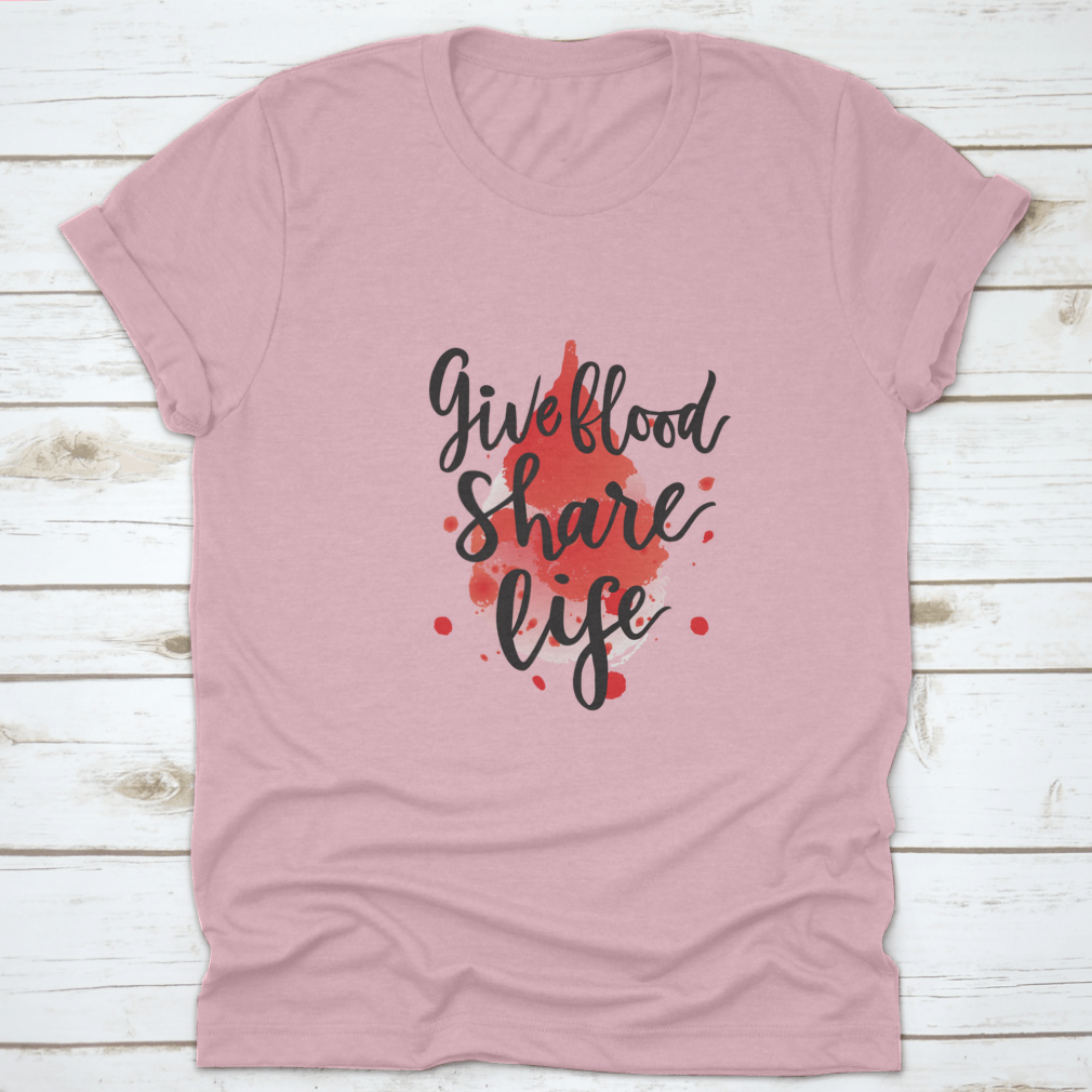 A stylish t-shirt featuring a watercolor drop design with the phrase 'Give Blood Share Life', made from 100% cotton for comfort.