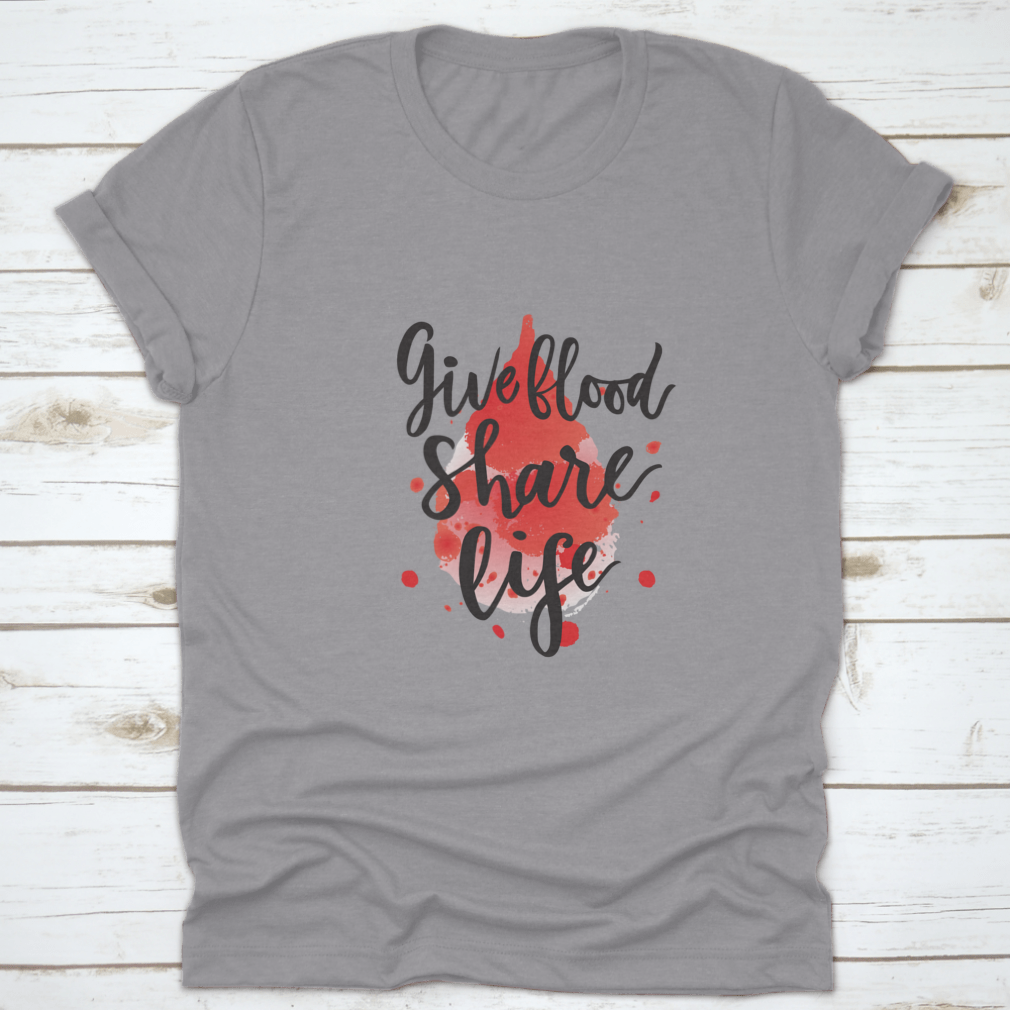 A stylish t-shirt featuring a watercolor drop design with the phrase 'Give Blood Share Life', made from 100% cotton for comfort.