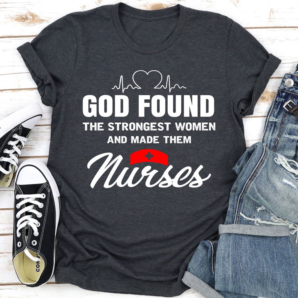 A comfortable t-shirt featuring the phrase 'God Found The Strongest Women And Made Them Nurses', made from soft ring-spun cotton.