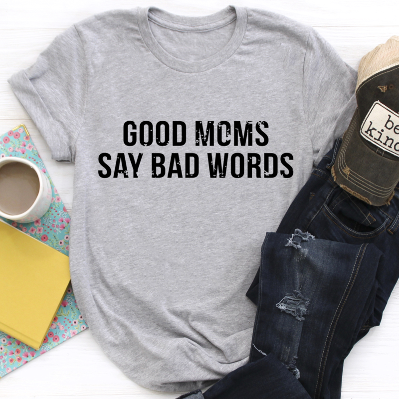 Good Moms Say Bad Words T-Shirt in various colors, showcasing its soft cotton fabric and durable stitching.