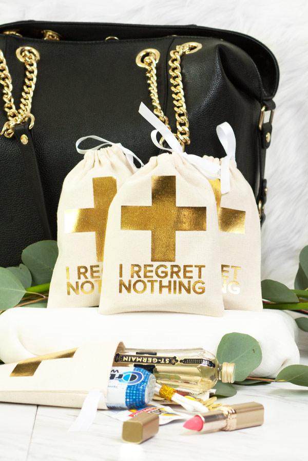 Gold Foil I Regret Nothing! Hangover Kit Bag, stylish canvas pouch with gold foil crosses, perfect for bachelorette parties.