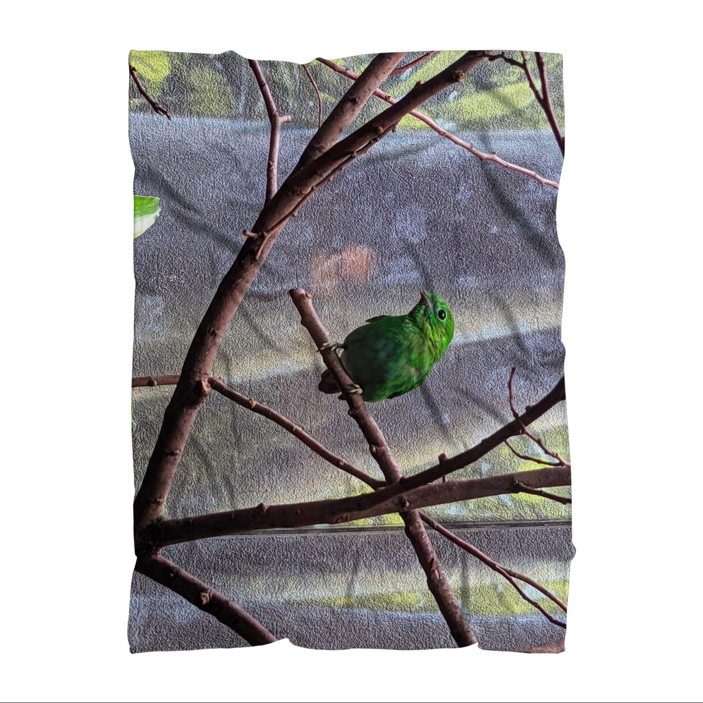 Green Bird Sublimation Throw Blanket made of soft polar fleece, featuring a vibrant bird design on a cozy fabric.