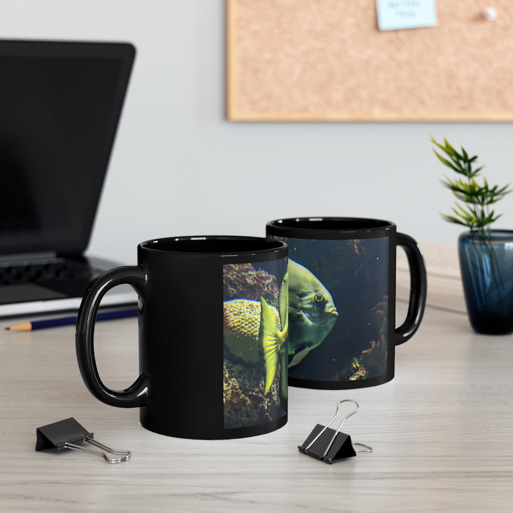 Green Fish 11oz black ceramic mug with a C-handle, perfect for coffee, tea, or hot chocolate.