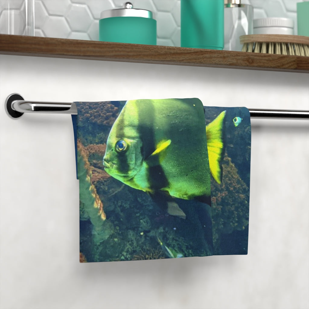 Green Fish Face Towel featuring a vibrant printed design on a soft polyester front and absorbent cotton back, ideal for personal use or gifting.