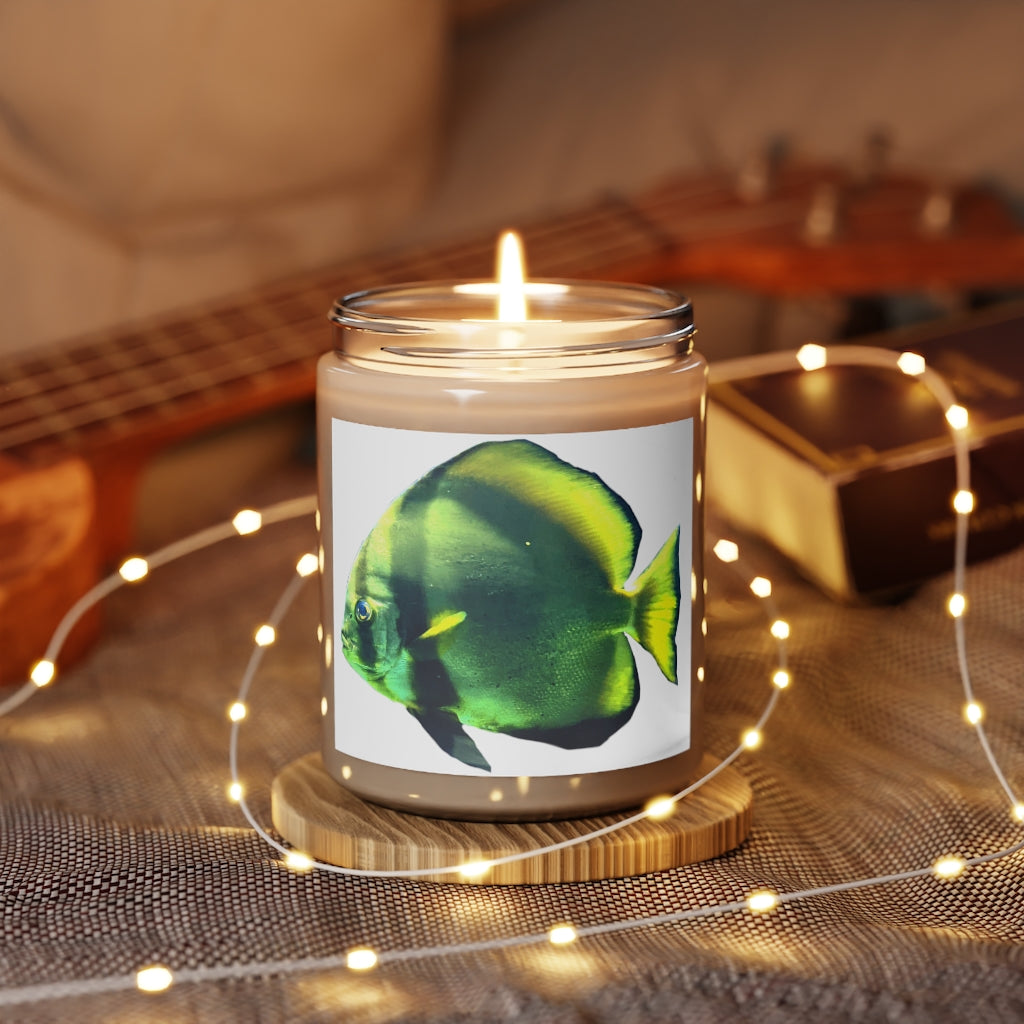 Green Fish Scented Candle in a glass container, featuring a permanent adhesive label, showcasing its soothing aroma and eco-friendly design.