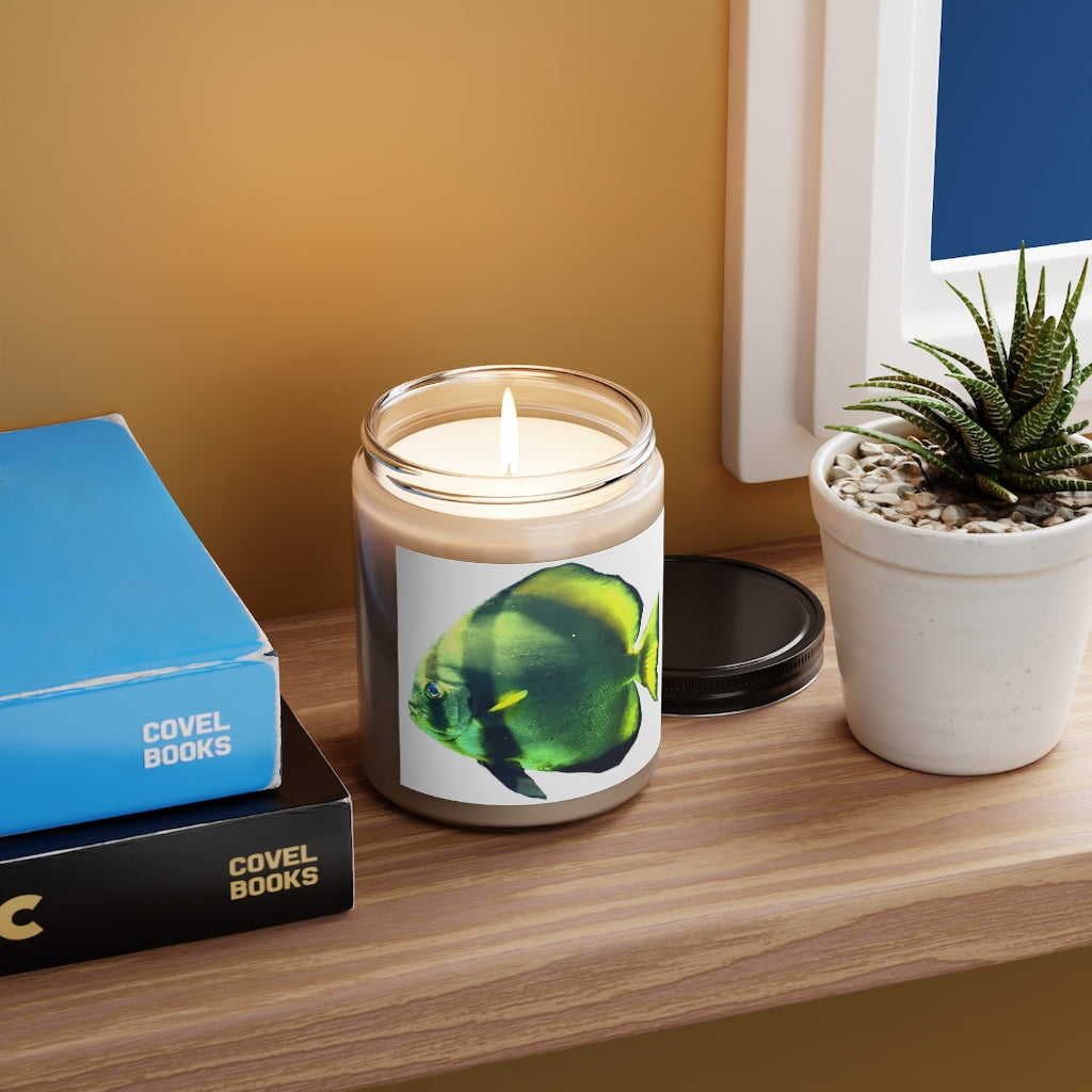 Green Fish Scented Candle in a glass container, featuring a permanent adhesive label, showcasing its soothing aroma and eco-friendly design.