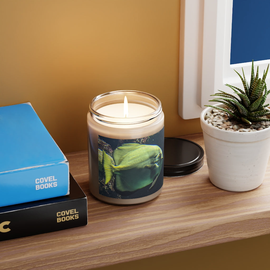 Green Fish Scented Candle in a glass container, showcasing its elegant design and vibrant label.