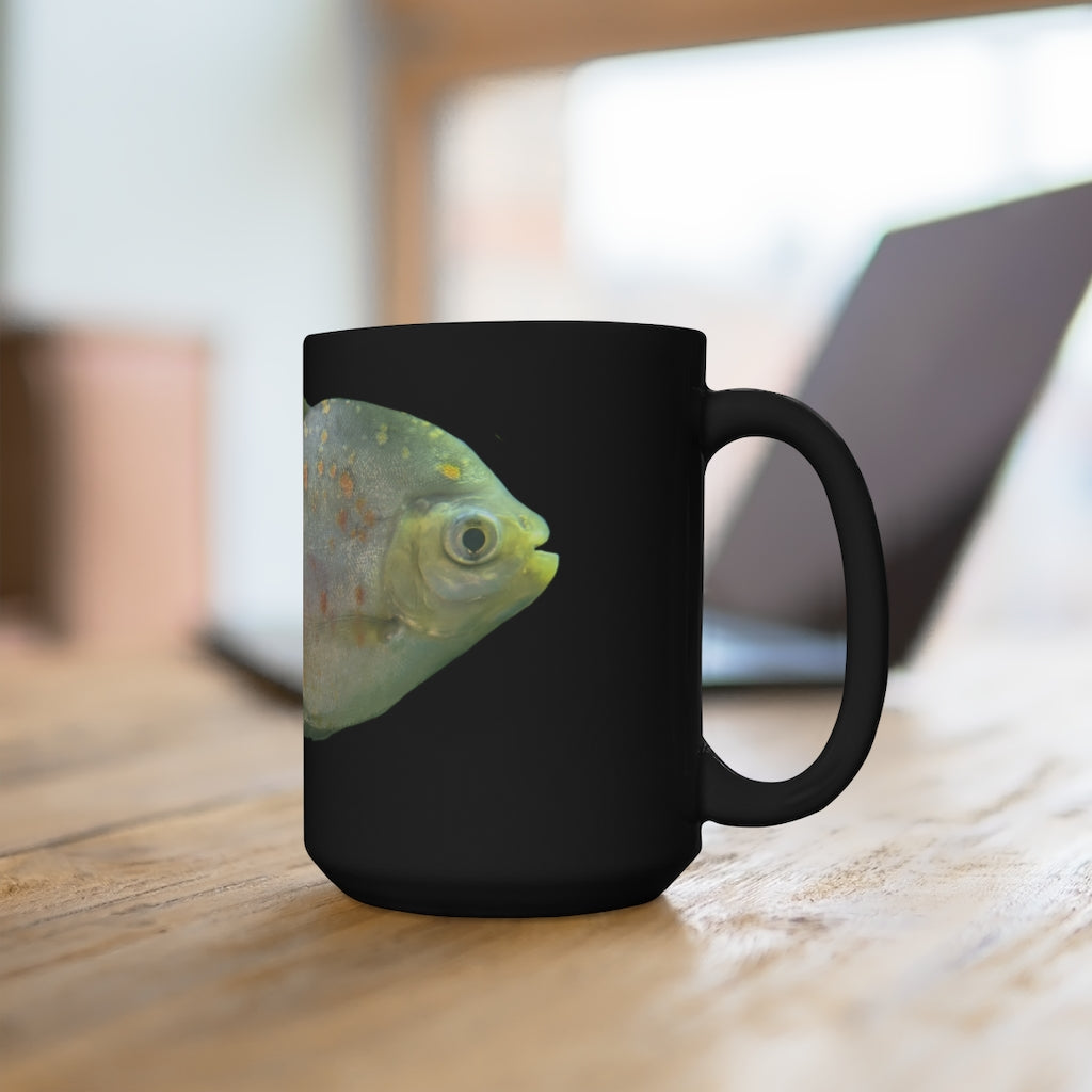 A stylish black ceramic mug featuring a green fish with specs design, perfect for coffee and tea lovers, holding 15oz of your favorite beverage.