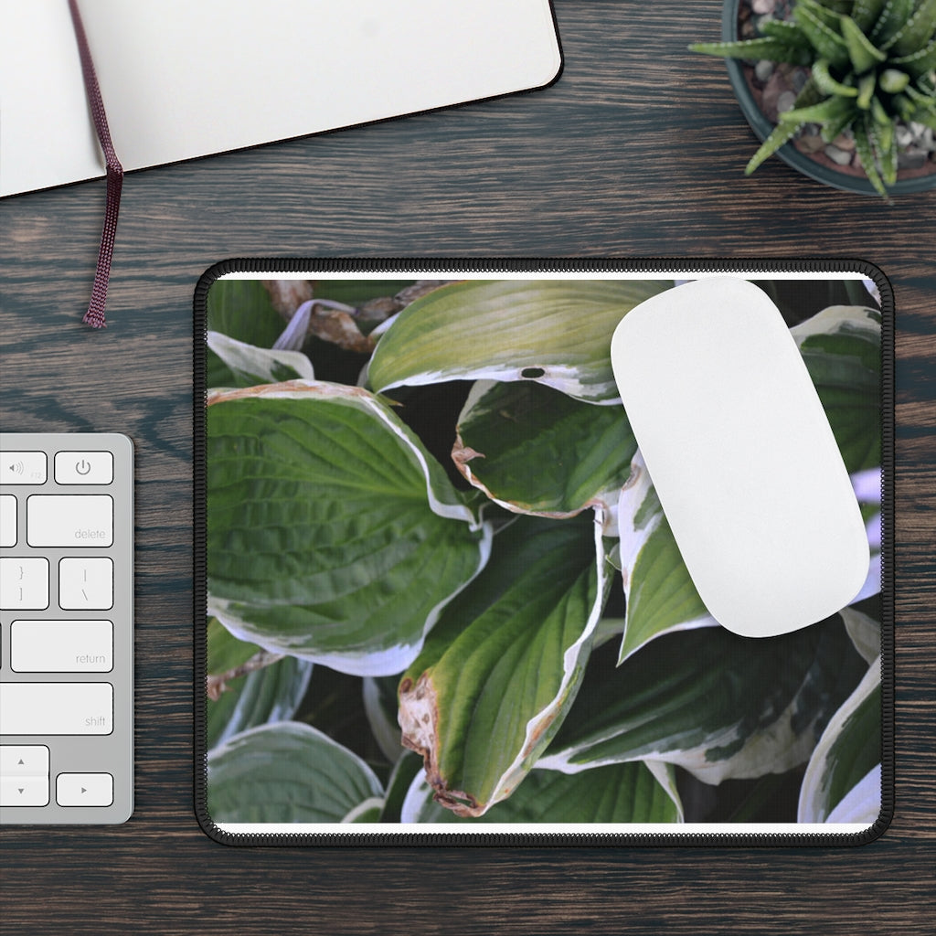 Green Leaves Gaming Mouse Pad featuring vibrant leaf designs and stitched edges, perfect for gaming and office use.
