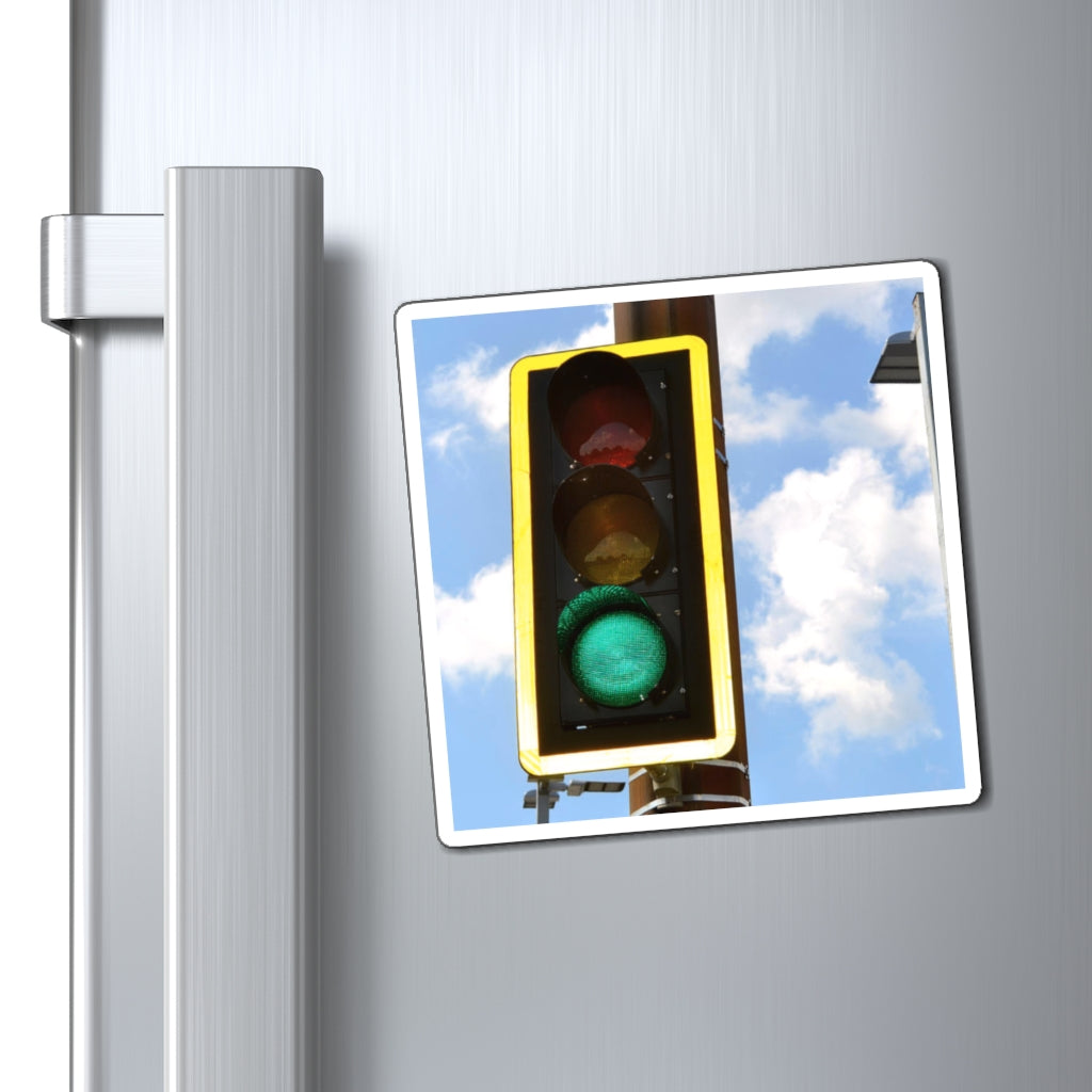 A set of vibrant green light magnets showcasing various sizes and a black backing, ideal for displaying messages on metallic surfaces.